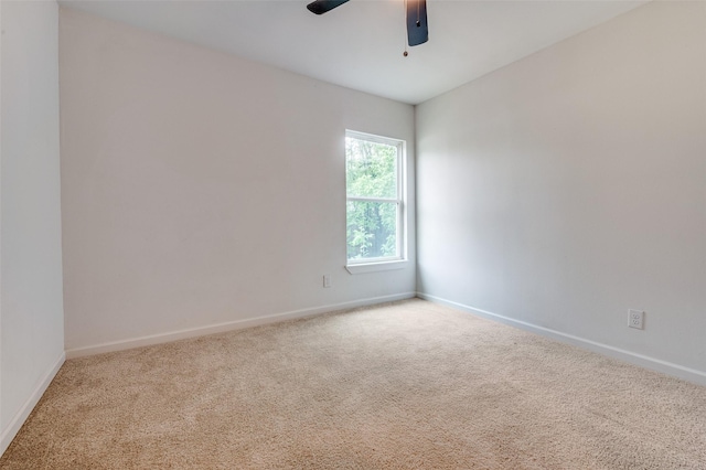 604 N E St, Arlington, TX 76011 - carpeted spare room featuring a ceiling fan and baseboards