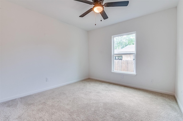 604 N E St, Arlington, TX 76011 - carpeted spare room with baseboards and ceiling fan