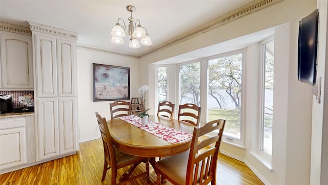 1351 Porter Ct, Granbury, TX 76048 - dining area with a chandelier, plenty of natural light, baseboards, and light wood-style flooring