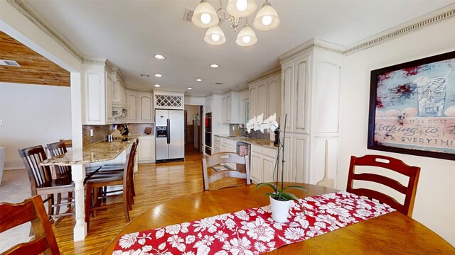 1351 Porter Ct, Granbury, TX 76048 - dining area featuring a chandelier, light wood-type flooring, visible vents, and recessed lighting