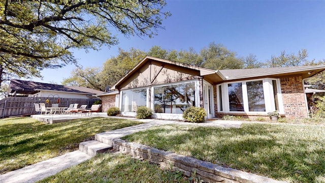 1351 Porter Ct, Granbury, TX 76048 - rear view of property with fence, a lawn, and a patio area