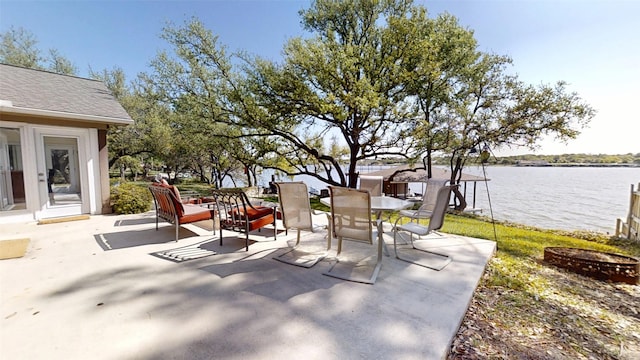 1351 Porter Ct, Granbury, TX 76048 - view of patio featuring a water view and outdoor dining space