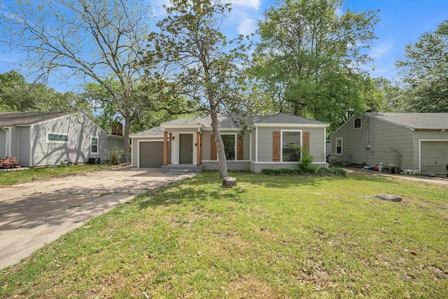 view of front of property with an attached garage, driveway, and a front lawn