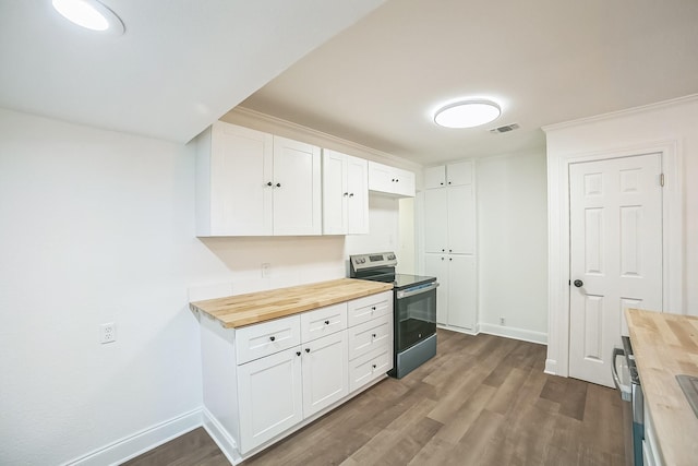 kitchen with wood counters, stainless steel electric stove, baseboards, dark wood-style flooring, and visible vents