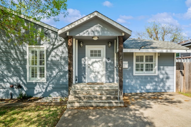 1413 S Waverly Dr, Dallas, TX 75208 - entrance to property with a shingled roof and fence
