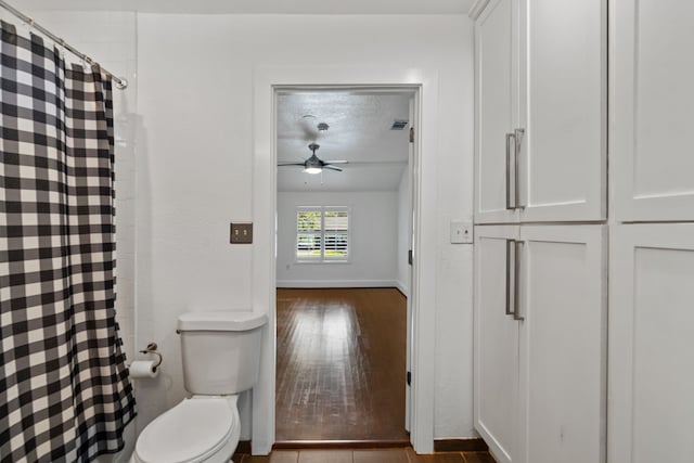 1413 S Waverly Dr, Dallas, TX 75208 - bathroom featuring a ceiling fan, wood finished floors, baseboards, toilet, and visible vents