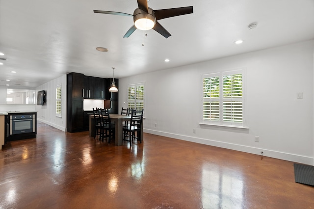 1413 S Waverly Dr, Dallas, TX 75208 - dining area featuring concrete floors, baseboards, ceiling fan, and recessed lighting