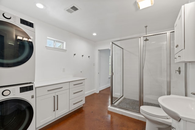 1413 S Waverly Dr, Dallas, TX 75208 - bathroom with a sink, a stall shower, visible vents, stacked washer / dryer, and finished concrete flooring