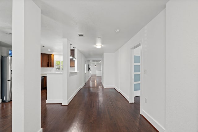 1413 S Waverly Dr, Dallas, TX 75208 - corridor with baseboards, visible vents, and dark wood finished floors