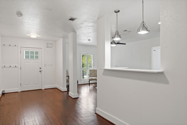 1413 S Waverly Dr, Dallas, TX 75208 - entrance foyer with dark wood-type flooring, visible vents, and baseboards