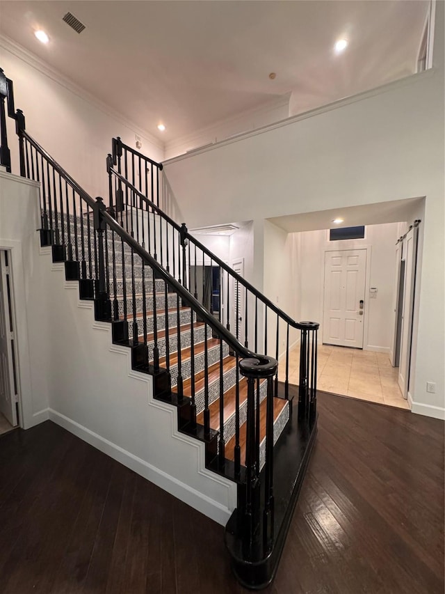 18815 Park Grove Ln, Dallas, TX 75287 - stairway featuring wood-type flooring, ornamental molding, baseboards, and recessed lighting