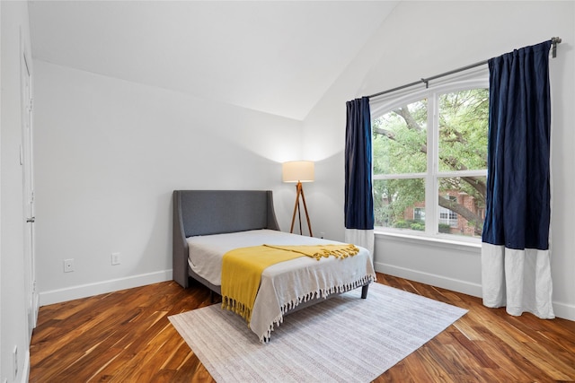 18815 Park Grove Ln, Dallas, TX 75287 - bedroom featuring lofted ceiling, baseboards, and wood finished floors