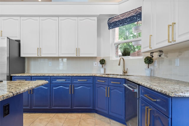 18815 Park Grove Ln, Dallas, TX 75287 - kitchen with blue cabinetry, a sink, appliances with stainless steel finishes, and white cabinetry