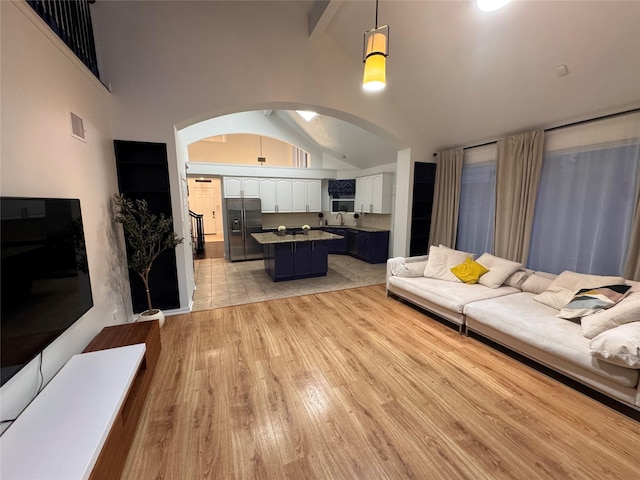 18815 Park Grove Ln, Dallas, TX 75287 - living area featuring arched walkways and light wood finished floors