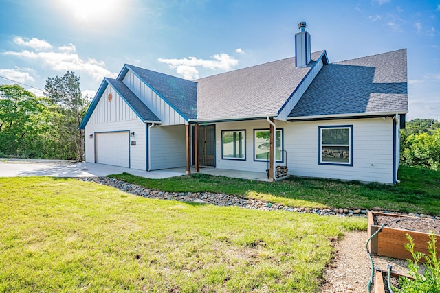 view of front of property with a chimney, a front lawn, driveway, a garage, and roof with shingles
