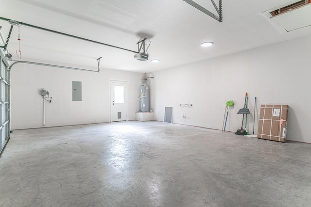 garage featuring electric panel, water heater, and a garage door opener
