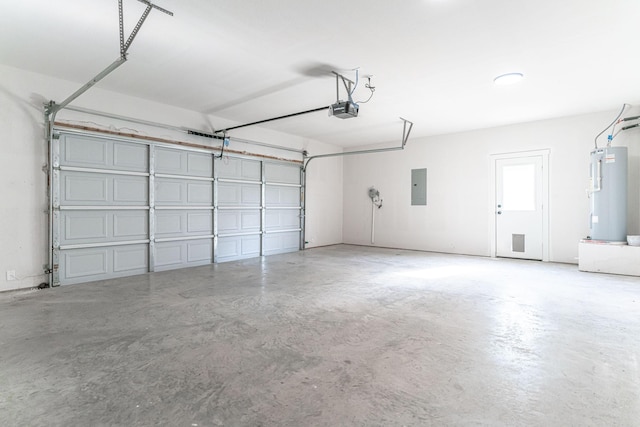 garage featuring water heater, a garage door opener, and electric panel