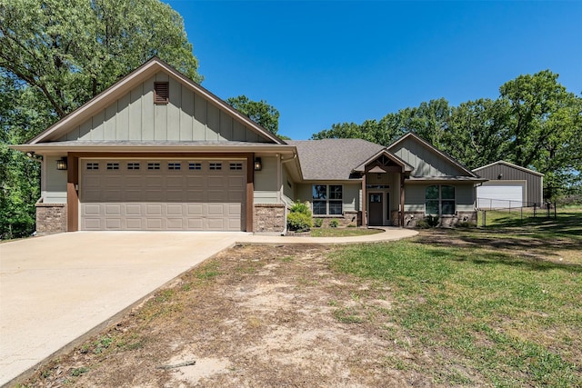 craftsman house with board and batten siding, brick siding, a garage, and concrete driveway