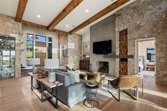 13555 Broken Arrow, Malakoff, TX 75148 - living room featuring hardwood / wood-style floors, beam ceiling, and a large fireplace