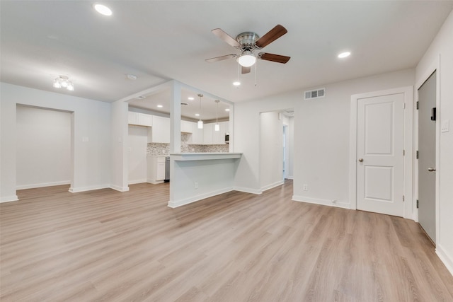 unfurnished living room with light wood-style floors, ceiling fan, baseboards, visible vents, and recessed lighting