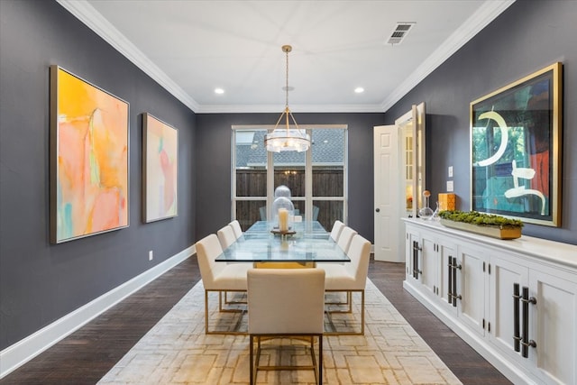 dining area with a chandelier, crown molding, dark wood finished floors, baseboards, and recessed lighting
