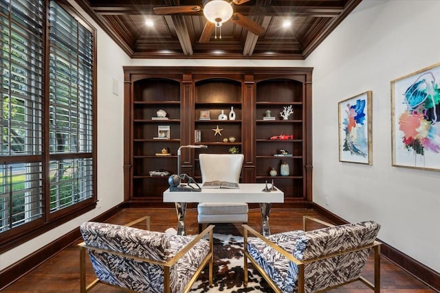 office space featuring baseboards, ornamental molding, a ceiling fan, coffered ceiling, and beam ceiling