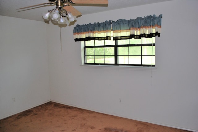 empty room with baseboards, carpet flooring, and ceiling fan