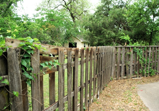 view of gate with fence