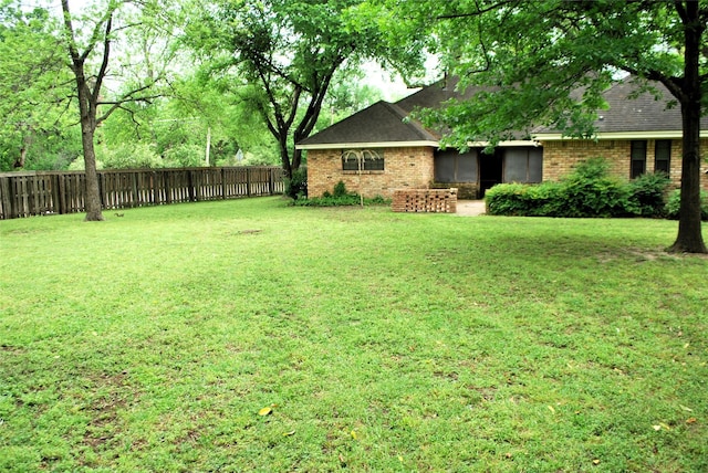 view of yard featuring fence