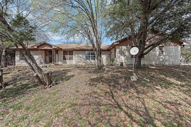 ranch-style house with brick siding