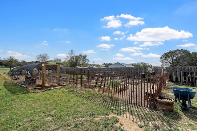 view of yard with a fenced backyard
