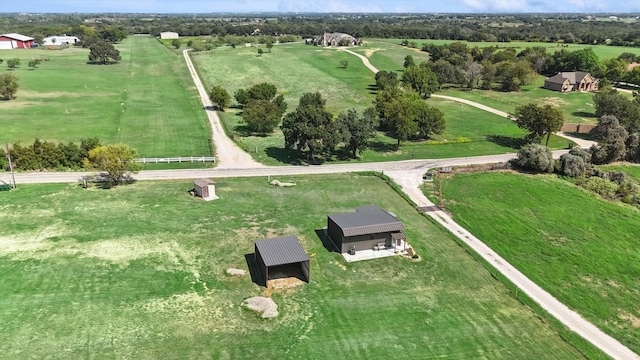 birds eye view of property with a rural view