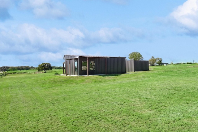 view of yard with an outdoor structure and an outbuilding