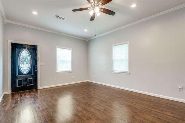 entrance foyer featuring ceiling fan, visible vents, dark wood-type flooring, and ornamental molding