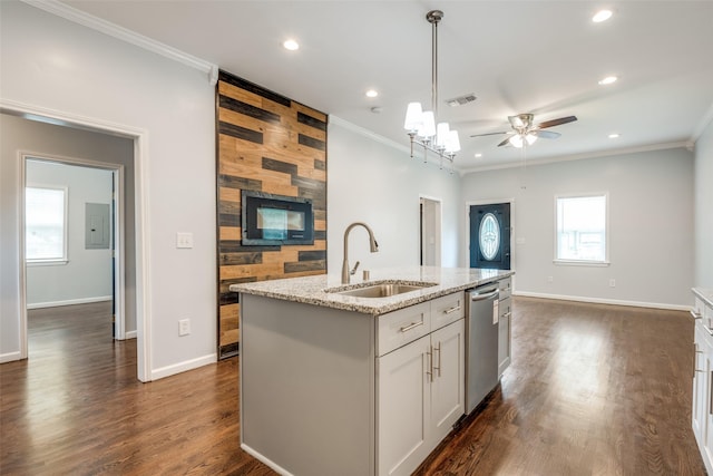 kitchen featuring stainless steel dishwasher, a sink, an island with sink, and ornamental molding