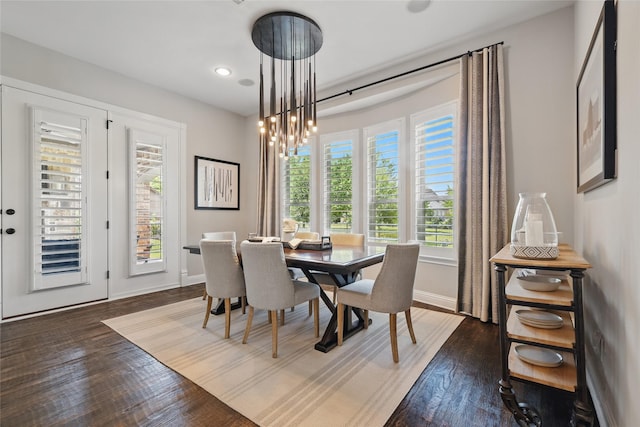 dining area with recessed lighting, wood finished floors, and baseboards