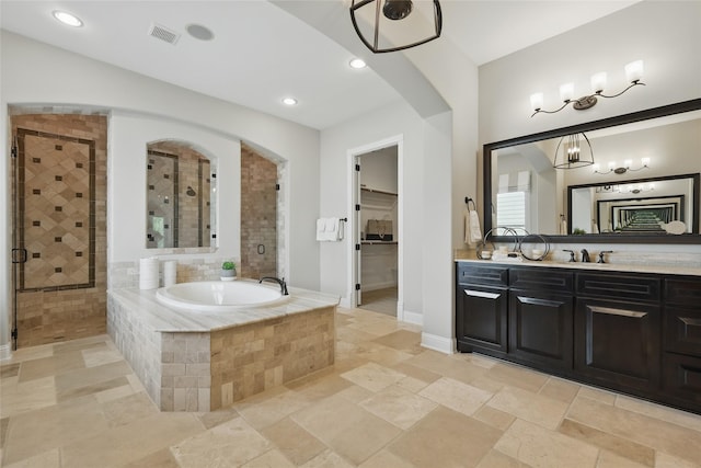 full bathroom with a garden tub, visible vents, vanity, and a stall shower