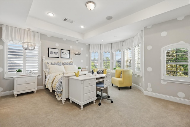 bedroom featuring a tray ceiling, baseboards, visible vents, recessed lighting, and light colored carpet