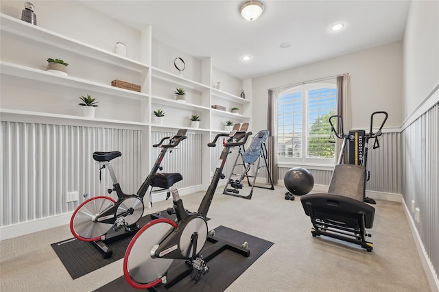 exercise area featuring baseboards, recessed lighting, and carpet