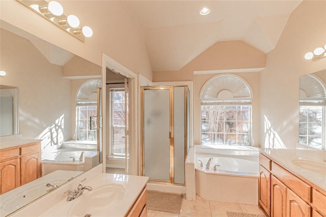 bathroom with two vanities, a garden tub, a sink, and a shower stall