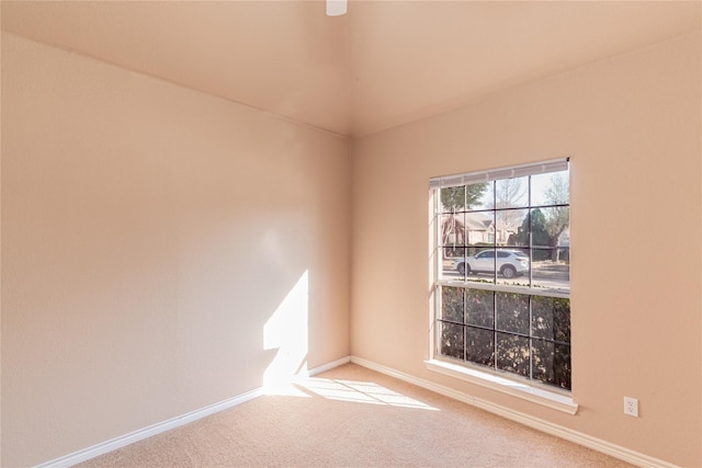 unfurnished room featuring baseboards and carpet floors