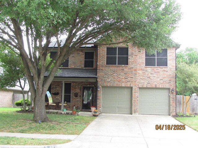 2709 Lakeside Dr, Burleson, TX 76028 - traditional-style house featuring driveway, covered porch, fence, a garage, and brick siding