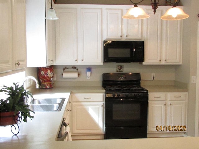2709 Lakeside Dr, Burleson, TX 76028 - kitchen featuring white cabinets, light countertops, a sink, and black appliances