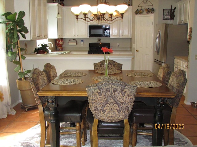 2709 Lakeside Dr, Burleson, TX 76028 - dining area featuring a chandelier and light tile patterned floors