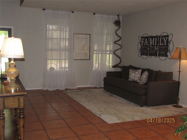 2709 Lakeside Dr, Burleson, TX 76028 - living room featuring tile patterned floors and baseboards