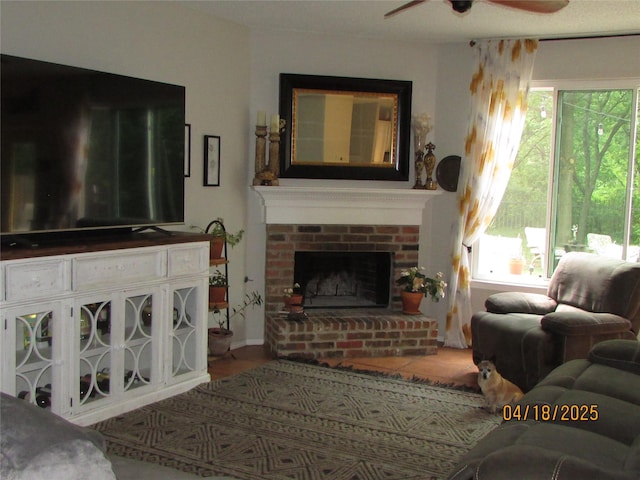 2709 Lakeside Dr, Burleson, TX 76028 - living area featuring wood finished floors, a fireplace, and ceiling fan