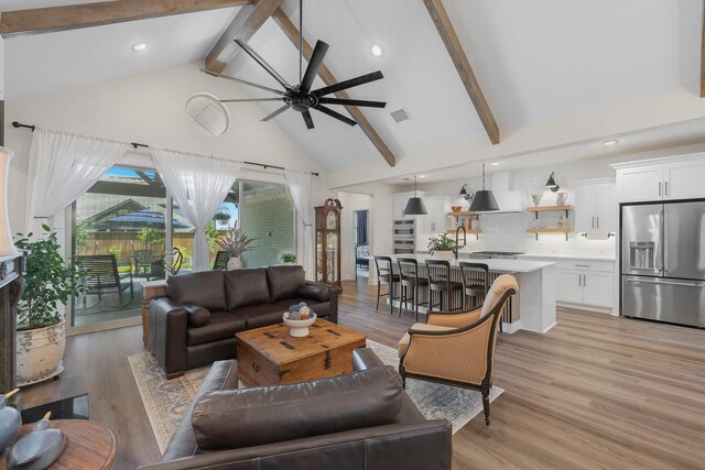 1236 Monterra Way, Fate, TX 75087 - living room with high vaulted ceiling, ceiling fan, light wood finished floors, beam ceiling, and recessed lighting