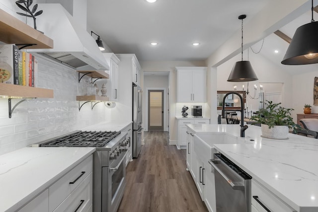 1236 Monterra Way, Fate, TX 75087 - kitchen featuring premium appliances, open shelves, a sink, custom range hood, and decorative backsplash