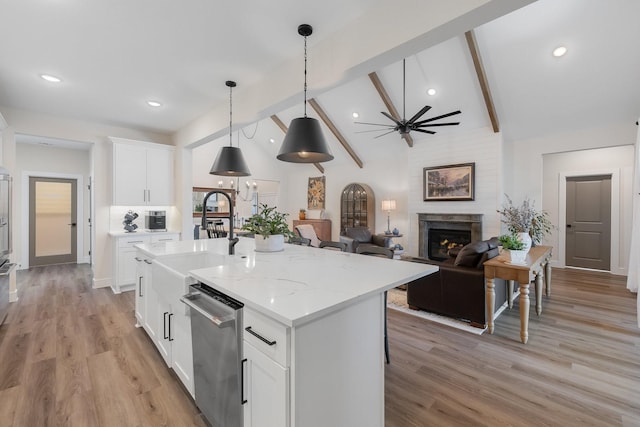 1236 Monterra Way, Fate, TX 75087 - kitchen with dishwasher, beam ceiling, a sink, white cabinets, and an island with sink