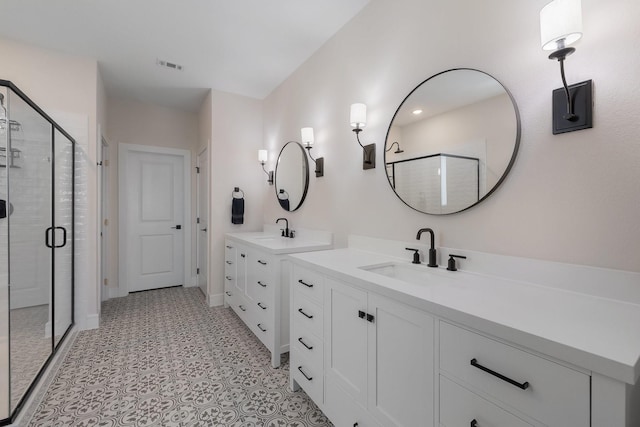 1236 Monterra Way, Fate, TX 75087 - bathroom featuring a stall shower, tile patterned floors, baseboards, and two vanities